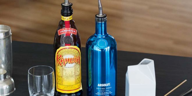 Kalhua and Absolut Vodka bottles, and the ingredients for White Russian